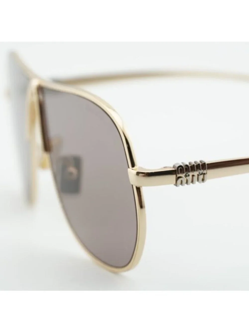 Miu Miu MUA56S 5AK20I Sunglasses Gold Geometric Frame, Purple Brown Lenses